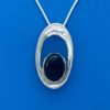 Oval, black onyx stone set in a beveled, silver oval hoop necklace