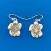 Silver earrings in the shape of pansy flowers