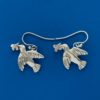 Silver earrings in the shape of flying doves carrying an olive branch in their beaks
